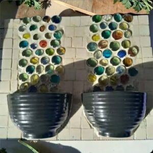 Terracotta Dreams — mosaic diptych by Sarah Ramharrack, colourful marbles in dark planters